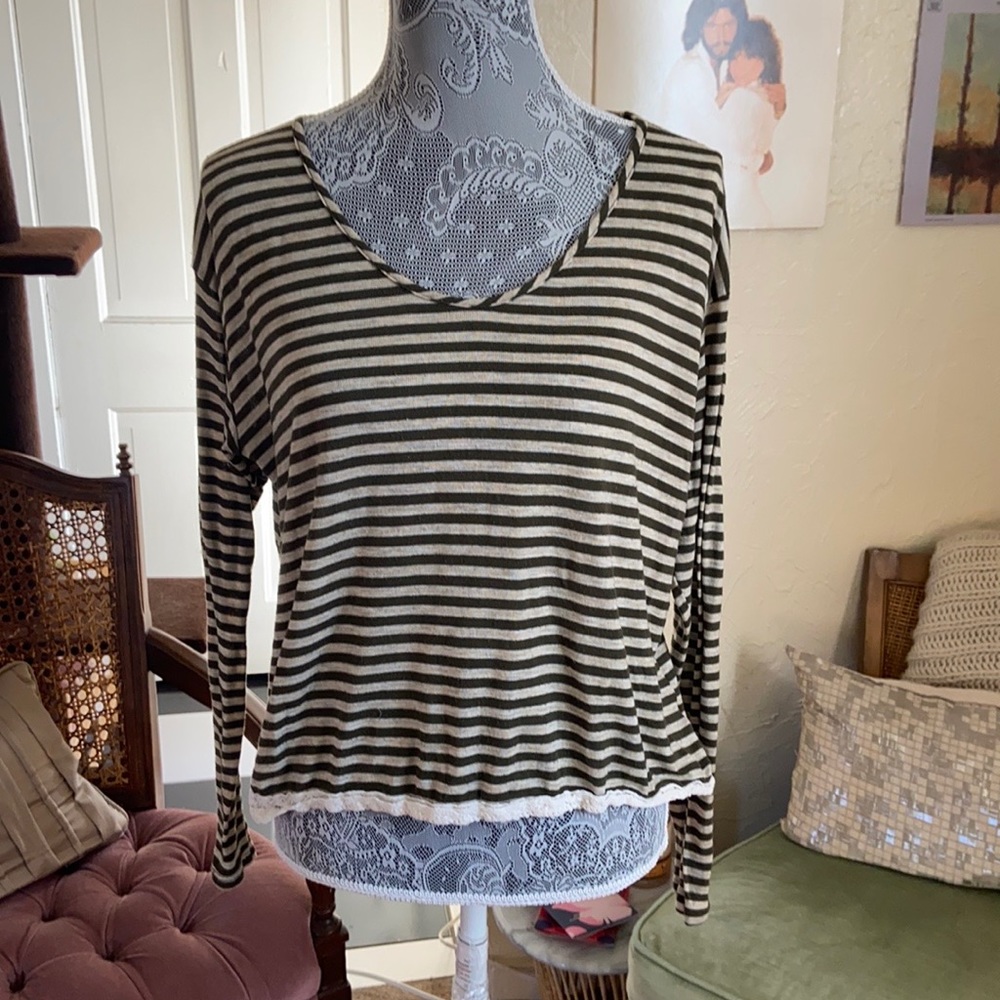 Green and white long sleeve shirt with cut out in the back.